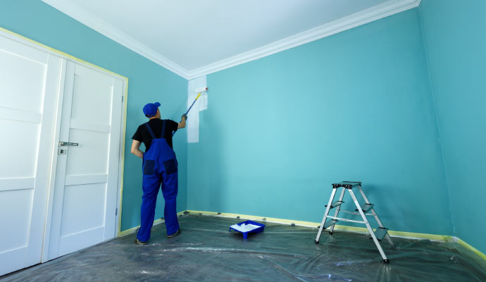 An Expert painter painting interior of a home