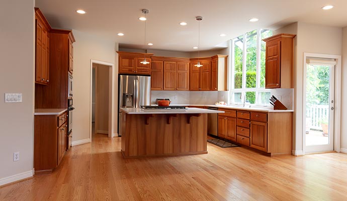 Modern kitchen with elegant sealant finish Modern kitchen area featuring elegant cabinets with durable sealant